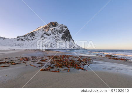 Breathtaking winter scenery on Uttakleiv beach at morning 97202640