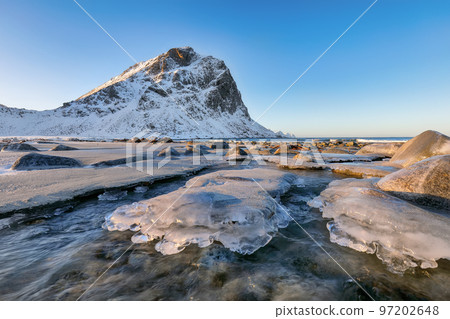 Breathtaking winter scenery on Uttakleiv beach at morning 97202648