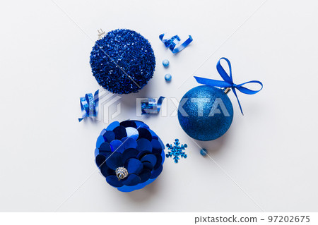 Christmas ball on colored background. decoration bauble with ribbon bow with copy space Christmas ball on colored background. decoration bauble with ribbon bow with copy space 97202675