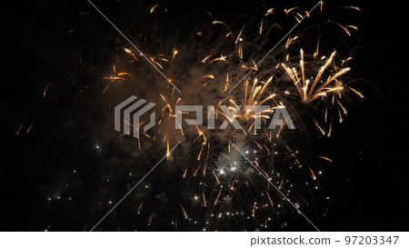 fireworks background. festive fireworks sky. new year, independence day, christmas, birthday. explosion colored lights. fiery flame sky. happy holiday. traditional holiday festival. fire spark effect 97203347