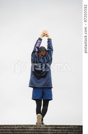 Women exercising in the park Women exercising in the park 97203592