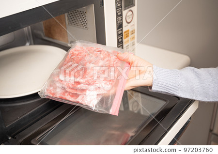 Thaw in a frozen beef microwave 97203760