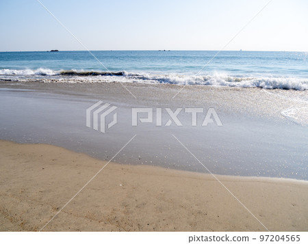 Waves on the sandy beach. 97204565