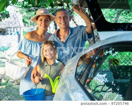 Family standing beside car Family standing beside car 97205746