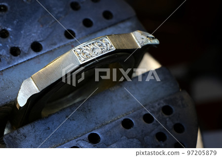 Close-up, metal engraving tools, watchmaker engraver work desk, selective focus Close-up, metal engraving tools, watchmaker engraver work desk, selective focus 97205879