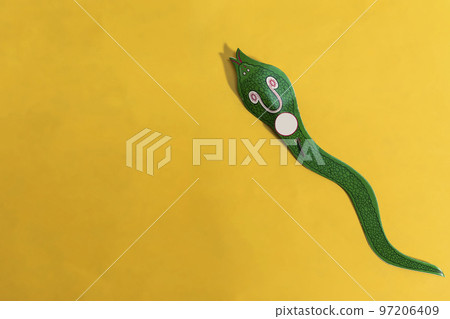 Indian Diwali firecrackers isolated on yellow background. Diwali snake cracker. Indian Diwali firecrackers isolated on yellow background. Diwali snake cracker. 97206409