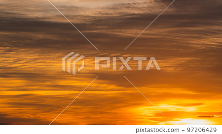 Western sky and clouds at dusk in late autumn shining golden wide 16:9 high saturation Western sky and clouds at dusk in late autumn shining golden wide 16:9 high saturation 97206429