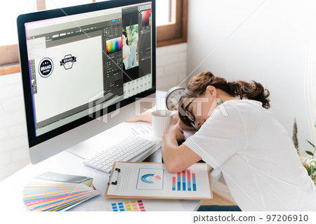 A Japanese woman who is a designer and creator who is tired and sleeps 97206910