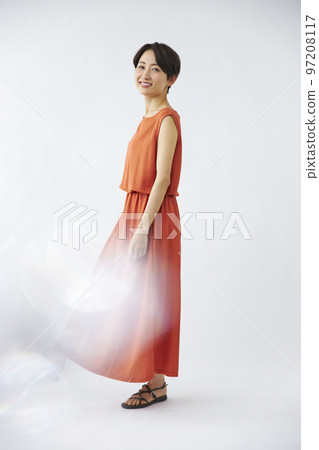 Middle woman in an orange dress 97208117