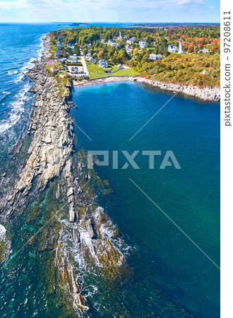 Aerial panorama of endless rocky coasts in Maine with houses, lighthouses, and fall foliage 97208611
