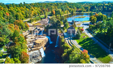 Large canyon with many waterfalls, Hydroelectric power plant, and nearby lake from drone Large canyon with many waterfalls, Hydroelectric power plant, and nearby lake from drone 97208766
