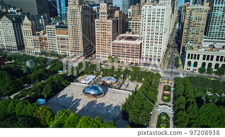 Chicago Millennium Park aerial view of iconic Cloud Gate Bean by skyscrapers 97208938
