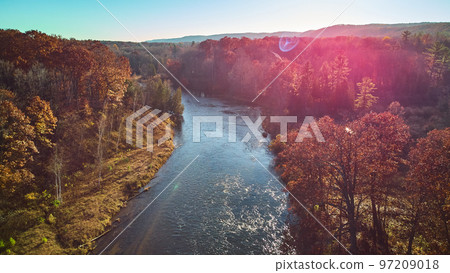 Aerial solar flare over Michigan river during late fall with warm colors Aerial solar flare over Michigan river during late fall with warm colors 97209018
