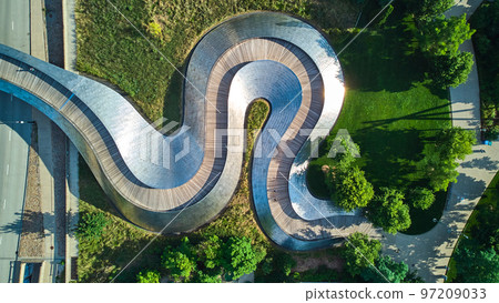 Wavy snake metal path of Pedestrian bridge from above at Millennium Park in Chicago Wavy snake metal path of Pedestrian bridge from above at Millennium Park in Chicago 97209033