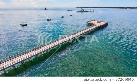 Long walking pier with view of island for lighthouse Long walking pier with view of island for lighthouse 97209040