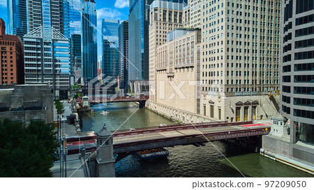 Chicago river ship canal with multiple bridges and reflective glass skyscrapers 97209050