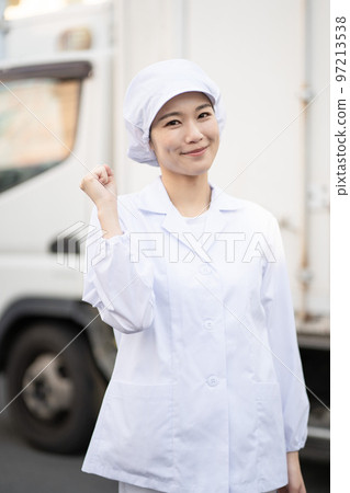 Young female food delivery driver (guts pose) Young female food delivery driver (guts pose) 97213538
