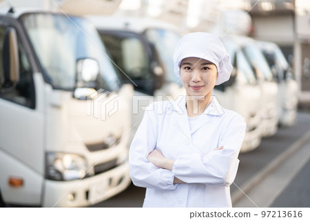 Young female food delivery driver (arms folded) 97213616