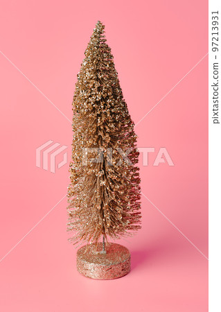 Hand made little golden Christmas tree decoration studio shot Hand made little golden Christmas tree decoration studio shot 97213931