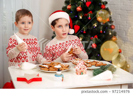 Preparing a gingerbread cookie house. Cooking Christmas gingerbread. 97214976