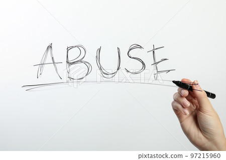 Woman writing word ABUSE on glass against white background, closeup. Domestic violence awareness 97215960