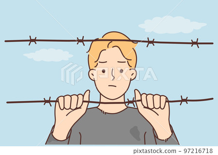 Man behind wires in prison Man behind wires in prison 97216718