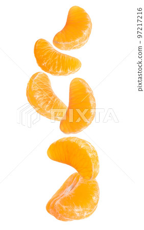 Fresh juicy tangerine pieces on white background Fresh juicy tangerine pieces on white background 97217216