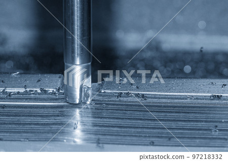 Close up scene the CNC milling machine rough cutting the injection mold parts by indexable tools. 97218332