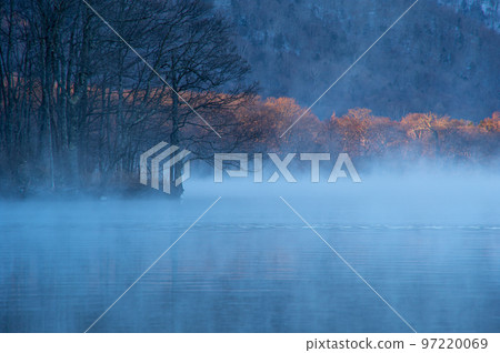 Lake at dawn with morning mist. Lake Kussharo in Hokkaido 97220069