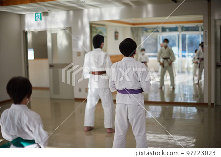 Children practicing in a karate classroom Children practicing in a karate classroom 97223023