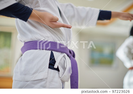 Children practicing in a karate classroom Children practicing in a karate classroom 97223026