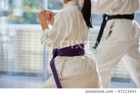 Children practicing in a karate classroom 97223041