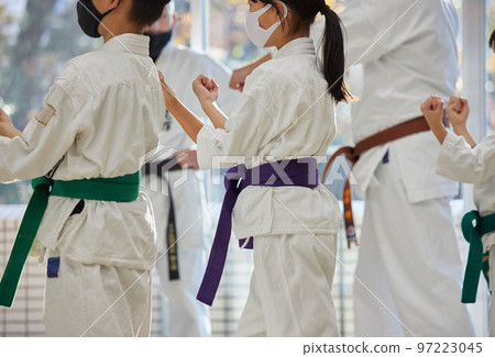 Children practicing in a karate classroom 97223045
