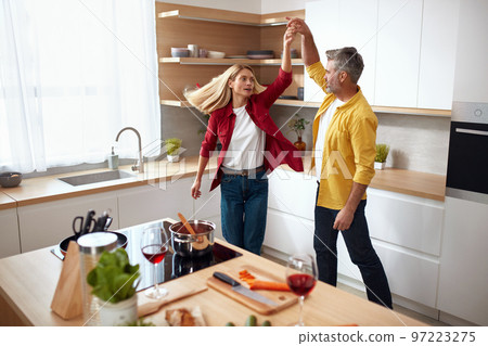 Romantic Couple Dancing Kitchen. Playful Mature Spouses Dancing And Smiling 97223275