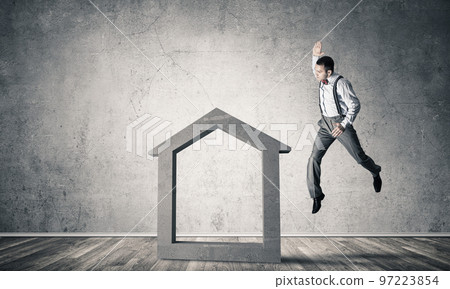 Stone home silhouette in empty room as symbol for real estate insurance Stone home silhouette in empty room as symbol for real estate insurance 97223854