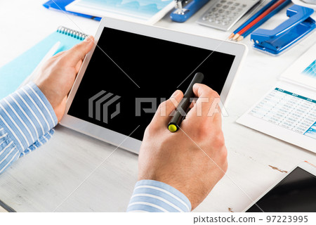 businessman with a tablet, works in the office businessman with a tablet, works in the office 97223995