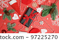 Christmas background. Fir tree branches, gift box and festive presents. 97225270