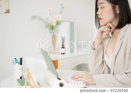 asian business and writer woman meeting online and typing by use retro keyboard and tablet 97226590
