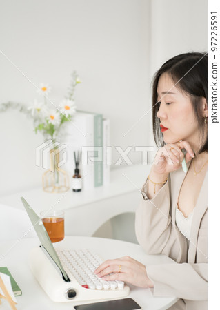 asian business and writer woman meeting online and typing by use retro keyboard and tablet asian business and writer woman meeting online and typing by use retro keyboard and tablet 97226591