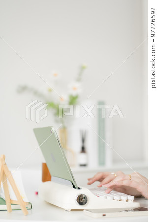 asian business and writer woman meeting online and typing by use retro keyboard and tablet asian business and writer woman meeting online and typing by use retro keyboard and tablet 97226592