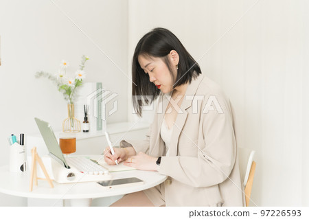 asian business and writer woman writing new her idea on book asian business and writer woman writing new her idea on book 97226593