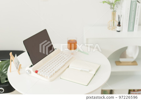 flat lay working accessory with retro keyboard book and pen on white table background flat lay working accessory with retro keyboard book and pen on white table background 97226596