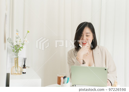 asian business and writer woman smile and happy during think new idea and meeting online 97226598