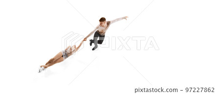 Death spiral. Portrait of young man and woman, figure skating athletes performing isolated over white studio background. Flyer Death spiral. Portrait of young man and woman, figure skating athletes performing isolated over white studio background. Flyer 97227862