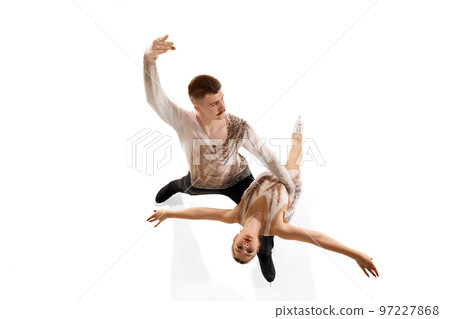 Short programme. Portrait of young man and woman, figure skating athletes performing isolated over white studio background 97227868