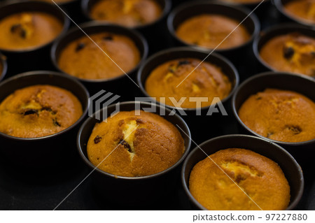 Cupcakes just form oven in cookie cutters. Baking at home. Selective focus. 97227880