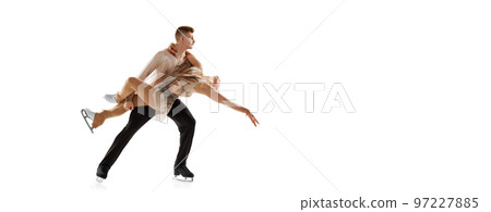 Support. Portrait of young man and woman, figure skating athletes performing, training isolated over white studio background. Flyer Support. Portrait of young man and woman, figure skating athletes performing, training isolated over white studio background. Flyer 97227885