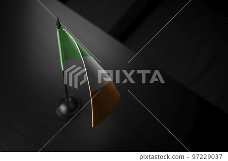 Small national flag of the Ireland on a black background 97229037