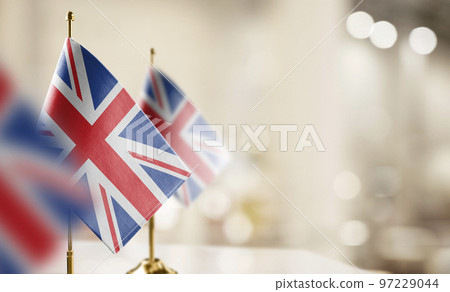 Small flags of the United Kingdom on an abstract blurry background 97229044