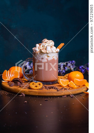 A mug of hot chocolate with cream and cinnamon stick, marshmallow A mug of hot chocolate with cream and cinnamon stick, marshmallow 97229865